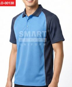 เสื้อโปโลยูนิฟอร์มสีฟ้าอ่อน ตัดต่อแขนและไหล่สีกรมท่า ปกสีกรมท่า สาบกระดุม 3 เม็ด และมีเส้นกุ๊นสีอ่อนตามแนวตัดต่อ ถ่ายสตูดิโอพื้นหลังสีขาว